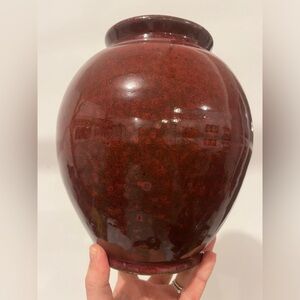 Beautiful hand-spun ceramic pottery vase in deep red